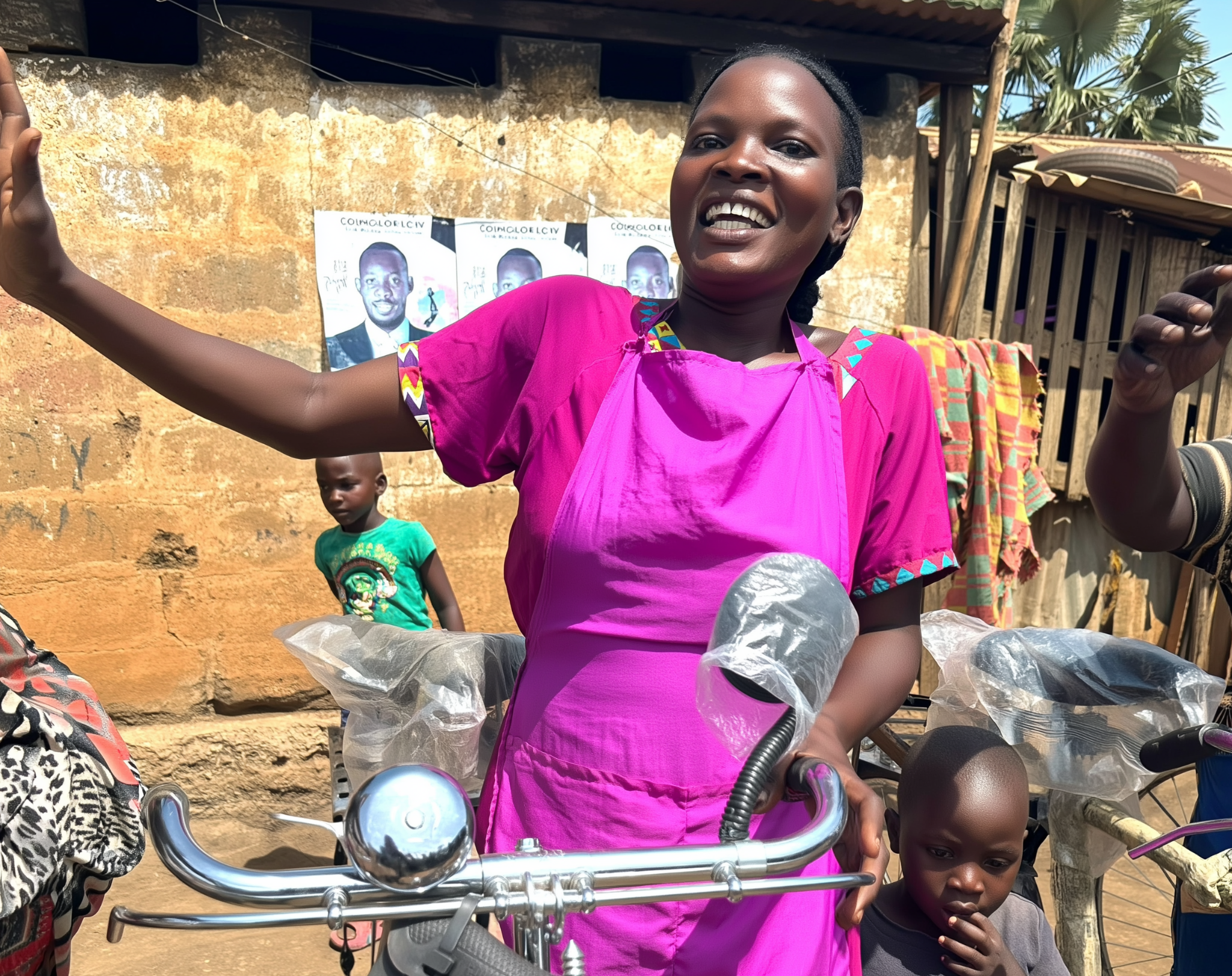 A bicycle recipient in Uganda standing with her new bicycle