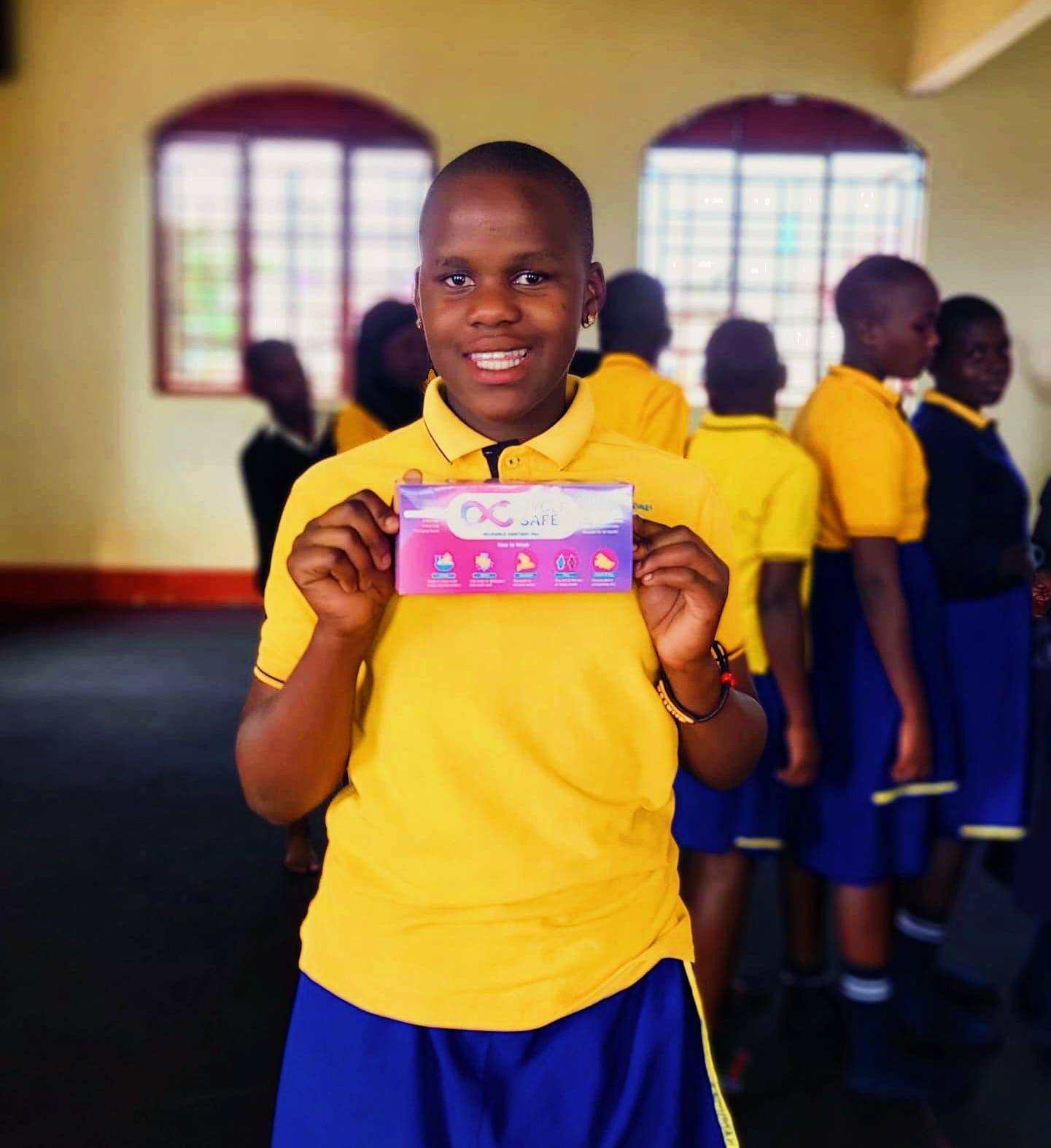 Students receiving reusable sanitary-pad sets in Uganda, photo 1
